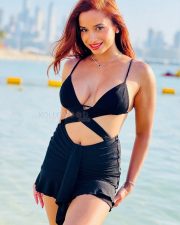 Alluring Actress Pooja Bhalekar in a Black Bikini Style Top with a Criss Cross Wrap and High Waisted Black Mini Skirt Pictures 01