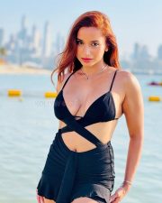 Alluring Actress Pooja Bhalekar in a Black Bikini Style Top with a Criss Cross Wrap and High Waisted Black Mini Skirt Pictures 02