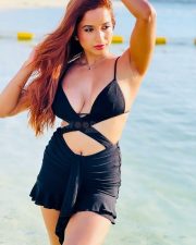Alluring Actress Pooja Bhalekar in a Black Bikini Style Top with a Criss Cross Wrap and High Waisted Black Mini Skirt Pictures 04