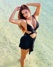 Alluring Actress Pooja Bhalekar in a Black Bikini Style Top with a Criss Cross Wrap and High Waisted Black Mini Skirt Pictures 07