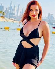 Alluring Actress Pooja Bhalekar in a Black Bikini Style Top with a Criss Cross Wrap and High Waisted Black Mini Skirt Pictures 09