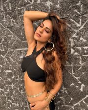 Attractive Nia Sharma in a Black Halter Neck Crop Top with a Matching High Waisted Black Flared Trousers Pictures 02
