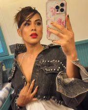 Bold Actress Nia Sharma in a Black One Shoulder Cut Out Top Photos 02