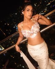 Captivating Nia Sharma in a Bustier Deep Neck Backless Bralette Top and Mermaid Skirt Photos 03