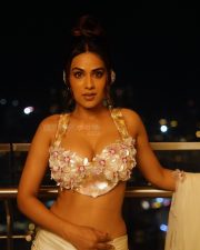 Captivating Nia Sharma in a Bustier Deep Neck Backless Bralette Top and Mermaid Skirt Photos 04