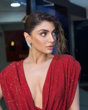Classy Akanksha Puri in a Shimmering Red Mini Dress with a Cleavage Cowl Neck Photos 02