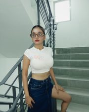 Cute Anushka Sen in a White Tank Top and Thigh Slit Black Skirt Photos 06