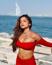 Dazzling Actress Pooja Bhalekar in a Red Off Shoulder Crop Top with a High Waisted Mini Skirt Pictures 01