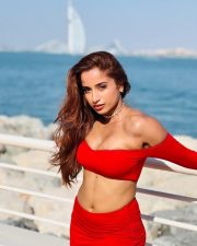 Dazzling Actress Pooja Bhalekar in a Red Off Shoulder Crop Top with a High Waisted Mini Skirt Pictures 05