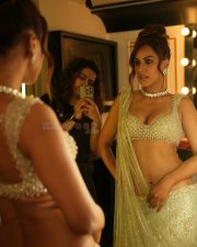 Desirable Nia Sharma in a Light Green Sequined Saree with a Sleeveless Deep U Neck Blouse Photos 01