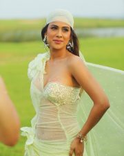 Mesmerizing Actress Nia Sharma in a Lime Green Sheer Embellished Mini Dress Photos 03