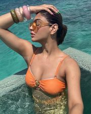 Sizzling Akanksha Puri in an Orange Two Piece Bikini Photos 03