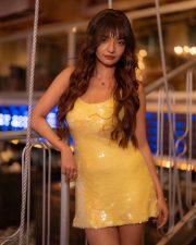 Social Media Hottie Anushka Sen in a Yellow Sequin Backless Mini Dress Photos 01