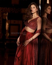Stunning Beauty Palak Tiwari in a Red Shimmery Lehenga with Plunging Neckline Photos 02
