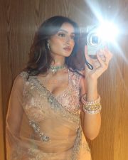 The Bhootnii Actress Palak Tiwari in a Glamorous Pink Sheer Saree with a Plunging Neck Bralette Style Blouse Photos 02