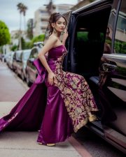 Young Beauty Anushka Sen in a Regal Wine Embroidered Strapless Gown at Cannes Film Festival Photos 07