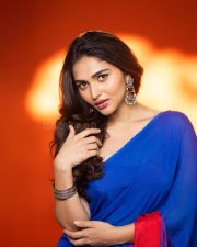 Actress Kayadu Lohar in a Deep Blue Saree with a Contrasting Red Sleeveless Blouse Pictures 01