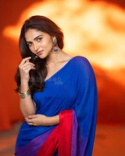 Actress Kayadu Lohar in a Deep Blue Saree with a Contrasting Red Sleeveless Blouse Pictures 02