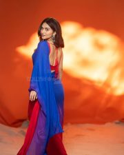Actress Kayadu Lohar in a Deep Blue Saree with a Contrasting Red Sleeveless Blouse Pictures 07