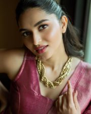 Actress Kayadu Lohar in a Pink Kachipuram Silk Saree with Gold Floral Motifs and Matching Sleeveless Blouse Photos 04