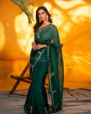 Actress Meenakshi Chaudhary in a Bottle Green Organza Saree with a Matching Green Blouse Photos 01