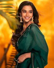 Actress Meenakshi Chaudhary in a Bottle Green Organza Saree with a Matching Green Blouse Photos 02
