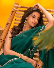 Actress Meenakshi Chaudhary in a Bottle Green Organza Saree with a Matching Green Blouse Photos 04