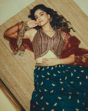 Actress Meenakshi Chaudhary in a Deep Forest Green Lehenga with an Embroidered Vest Style Crop Top Pictures 01