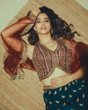 Actress Meenakshi Chaudhary in a Deep Forest Green Lehenga with an Embroidered Vest Style Crop Top Pictures 02