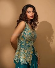 Actress Meenakshi Chaudhary in a Designer Pine Green Peplum Gharara Set Pictures 01