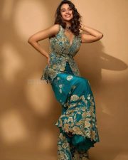 Actress Meenakshi Chaudhary in a Designer Pine Green Peplum Gharara Set Pictures 03