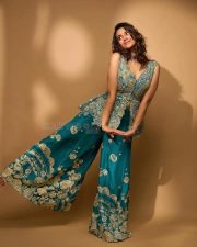 Actress Meenakshi Chaudhary in a Designer Pine Green Peplum Gharara Set Pictures 04