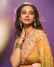 Actress Meenakshi Chaudhary in a Designer Sunset Orange Floral Embroidered Saree with a Contrasting Lime Yellow Sequin Blouse Pictures 01