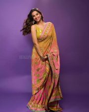 Actress Meenakshi Chaudhary in a Designer Sunset Orange Floral Embroidered Saree with a Contrasting Lime Yellow Sequin Blouse Pictures 02