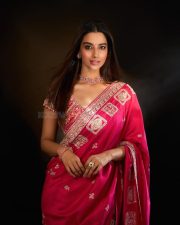 Actress Meenakshi Chaudhary in a Hot Pink Embroidered Saree with a Short Sleeved Low Cut Blouse Pictures 02
