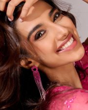 Anaganaga Oka Raju Heroine Meenakshi Chaudhary in a Pink Embellished Crop Top and High Waisted Draped Skirt Photos 03