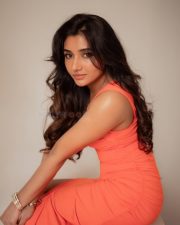 Beautiful Mirnaa Menon in an Orange One Shoulder Dress Pictures 01