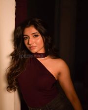 Birthmark Actress Mirnaa in an One Shoulder Burgundy Knit Top with a Grey Wash Jeans Photos 02