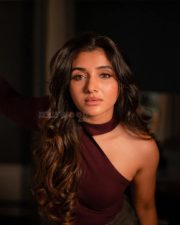 Birthmark Actress Mirnaa in an One Shoulder Burgundy Knit Top with a Grey Wash Jeans Photos 03