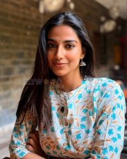 Delightful Actress Meenakshi Chaudhary in a Cream Floral Print Kurta Photos 05