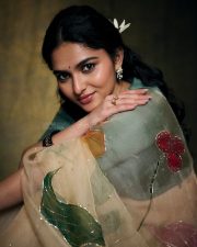 Enchanting Actress Kayadu Lohar in a Cream Floral Organza Saree with Teal Blouse Photos 01