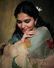 Enchanting Actress Kayadu Lohar in a Cream Floral Organza Saree with Teal Blouse Photos 02
