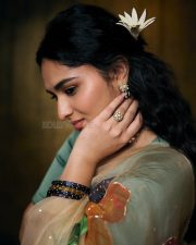 Enchanting Actress Kayadu Lohar in a Cream Floral Organza Saree with Teal Blouse Photos 04