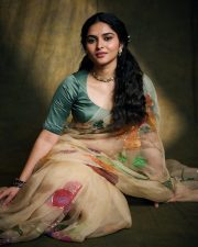 Enchanting Actress Kayadu Lohar in a Cream Floral Organza Saree with Teal Blouse Photos 05