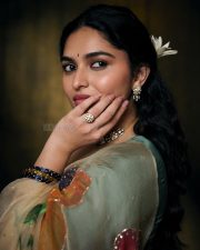 Enchanting Actress Kayadu Lohar in a Cream Floral Organza Saree with Teal Blouse Photos 09