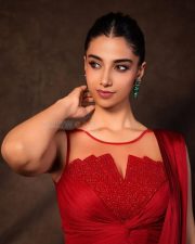 Glamorous Meenakshi Chaudhary in a Red Satin Lehenga Saree with a Embroidered Sheer Net Round Neck Photos 01