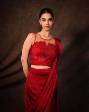 Glamorous Meenakshi Chaudhary in a Red Satin Lehenga Saree with a Embroidered Sheer Net Round Neck Photos 03