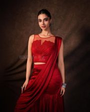 Glamorous Meenakshi Chaudhary in a Red Satin Lehenga Saree with a Embroidered Sheer Net Round Neck Photos 04