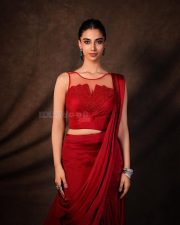 Glamorous Meenakshi Chaudhary in a Red Satin Lehenga Saree with a Embroidered Sheer Net Round Neck Photos 06