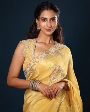 Gorgeous Meenakshi Chaudhary in a Yellow Saree with Yellow Embroidered Blouse with Floral Patterns Photos 04